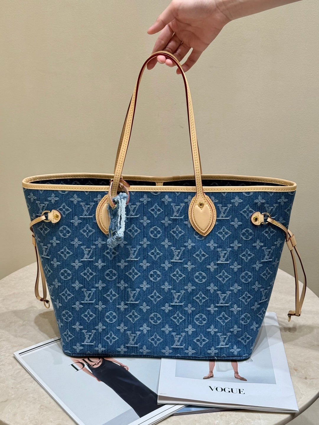 Louis Vuitton Denim Monogram Neverfull tote bag, luxury designer handbag with denim and monogram canvas, stylish and spacious.