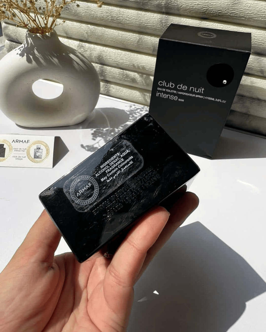 Luxivio Armaf Club De Nuit Intense Man Eau De Toilette 105ml bottle with dark packaging and silver cap, luxury men's fragrance.