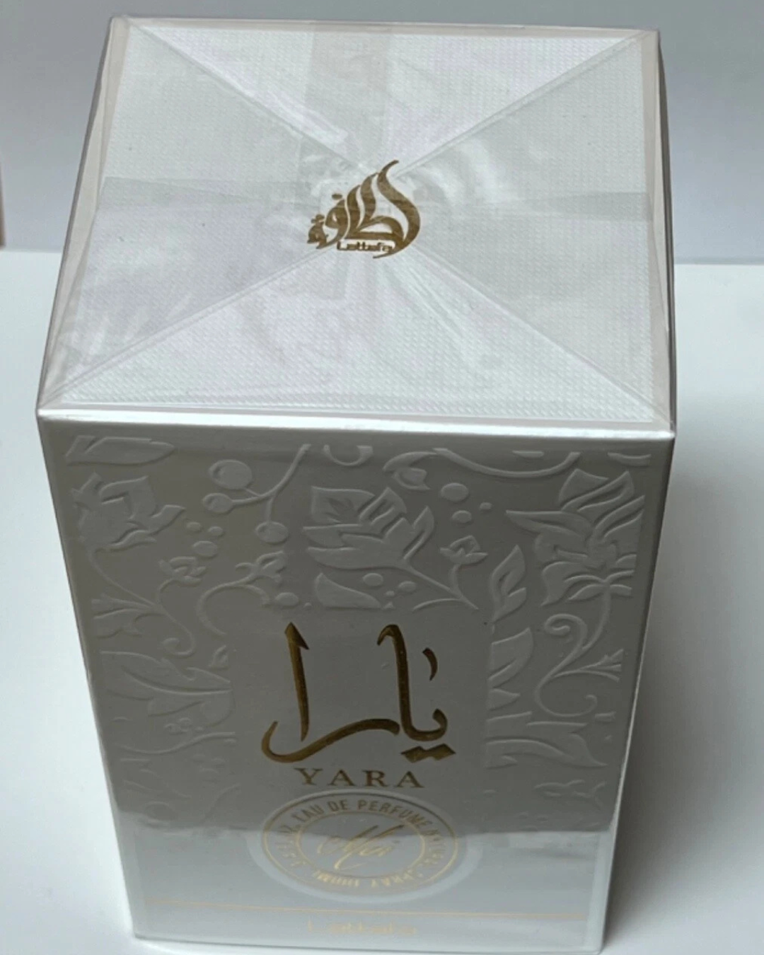 Lattafa Yara Moi Eau De Parfum 100ml bottle, luxurious creamy sweet women's fragrance with elegant packaging.
